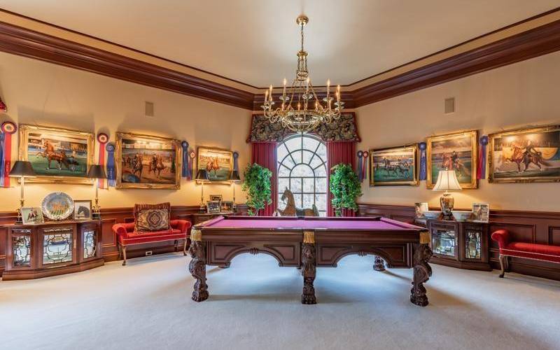Beautiful room with lots of built in display cases and wonderful woodwork